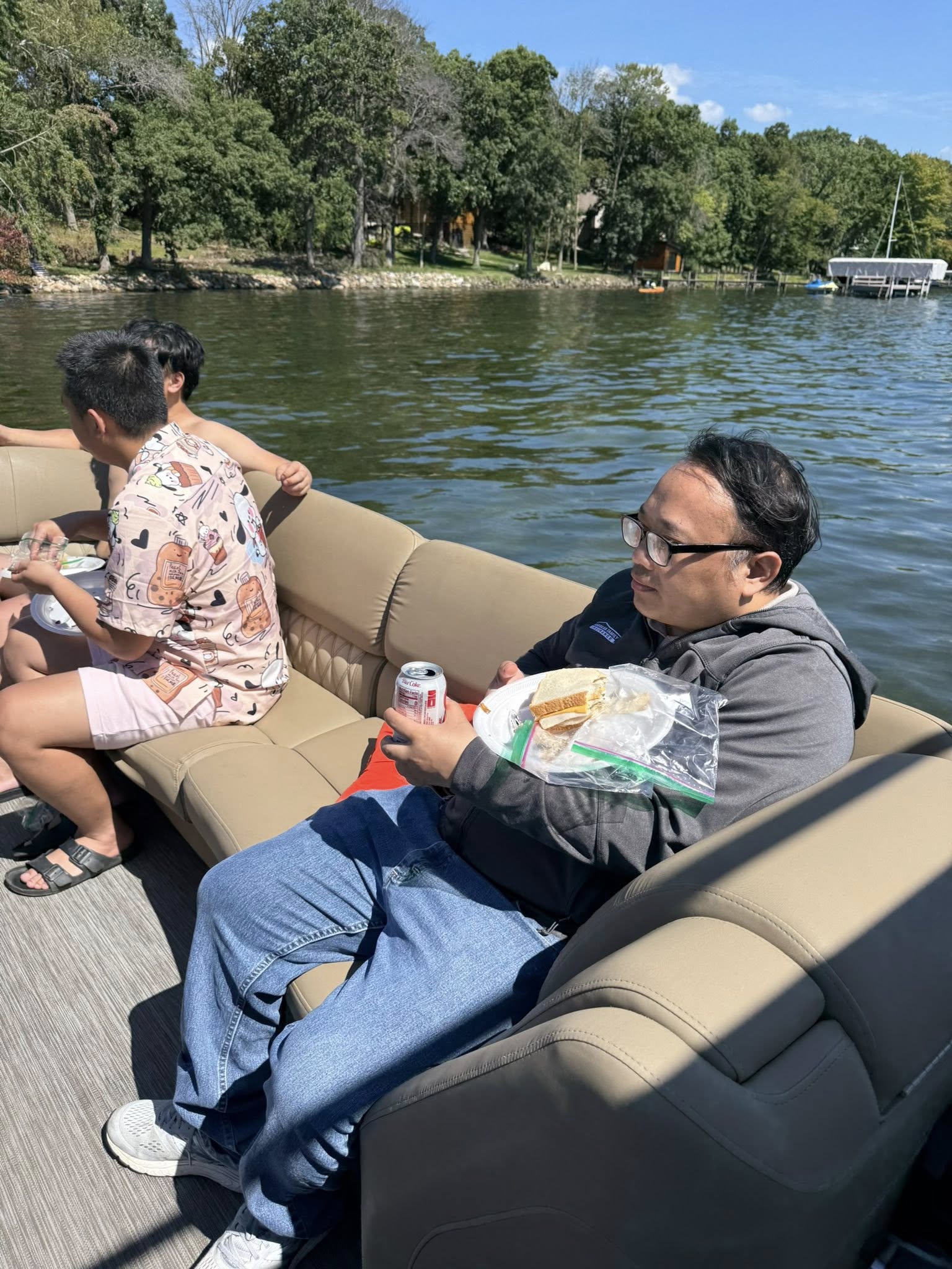 Brother smiling on the pontoon in the sun