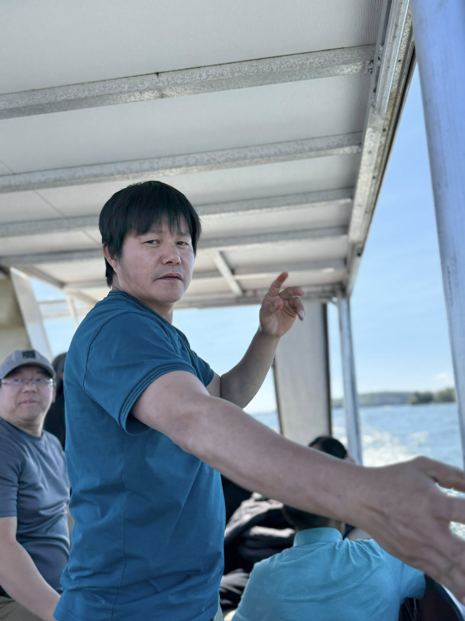 Men on the boat sharing food and snacks